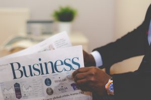 A man reading a business newspaper