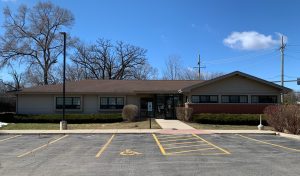 The parking lot and front view of a building at Crystal Lake