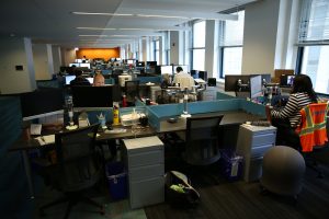 An office space partially filled with employees