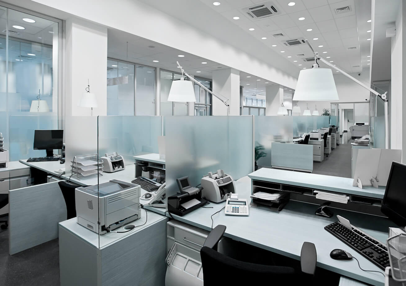 empty office cubicles with glass dividers