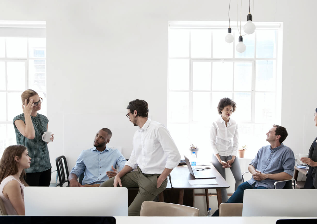 A handful of coworkers collaborating in a spacious office